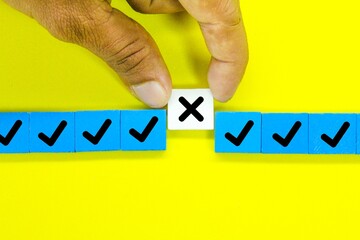 colored squares with the correct sign and one incorrect sign. the concept of check marks