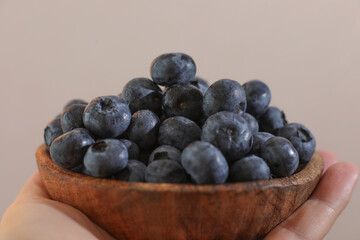 blueberries in a wooden bowl