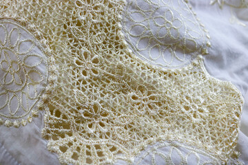 gold pattern on white fabric