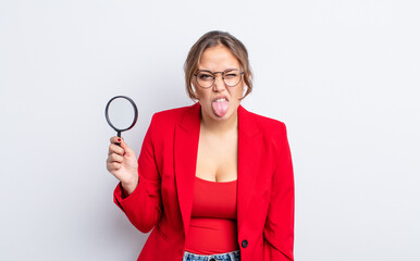 hispanic pretty woman feeling disgusted and irritated and tongue out. magnifying glass concept