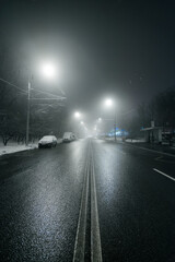 Empty street in foggy city