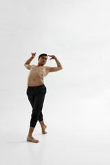 Young male dancer dancing classical ballet dance