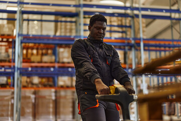 Focused adult man, moving through the factory.