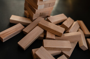 Education, risk, development and growth concept. jenga game. The businessman controls his strategy....
