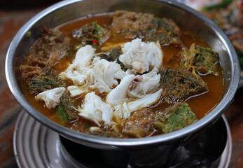 Sour Curry with Vegetable Omelet and Crab meat. Popular Thai local food called Gangsom.