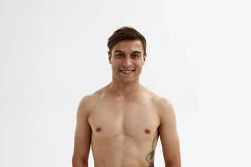 Fototapeta premium Young smiling caucasian man looking at camera