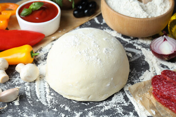 Concept of cooking pizza on gray wooden background