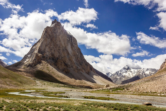 The Kargyak river with the granite mountain peak of Mount Gumbok Rangjon on the Darcha Padum trekking route in the Zanskar valley in Ladakh..