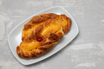 typical portuguese sweet bread with cream on the dish