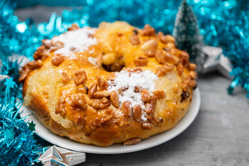 typical portuguese fruit cake Bolo rainha on white dish