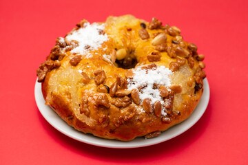 typical portuguese fruit cake Bolo rainha on white dish