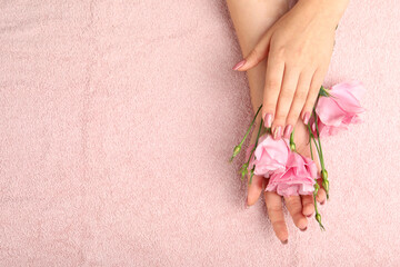 Concept of hand care on pink towel background