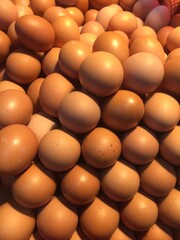 CPile of raw chicken eggs.lose-up of raw and fresh chicken eggs.