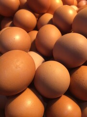 Pile of resh raw chicken eggs.
