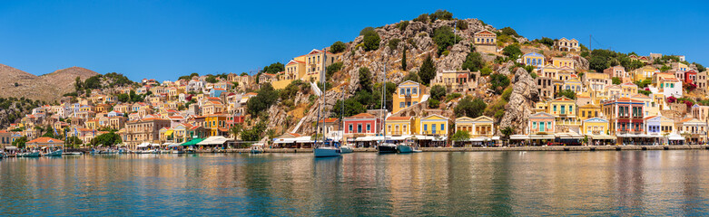 Fototapeta na wymiar Symi, Greek island with the fabulous colorful architecture. View of the waterfront.