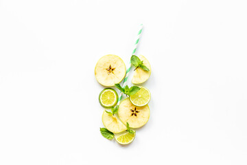 Concept of slices fruits as cocktail or juice glass with cocktail tube