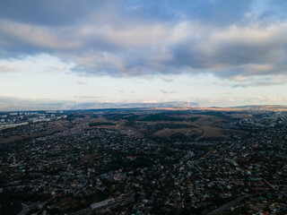 Obraz premium Beautiful storm clouds over the city. Panorama from above.