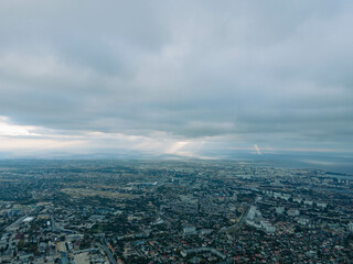 Fototapeta premium Beautiful storm clouds over the city. Panorama from above.