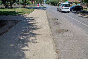Holes in the asphalt road