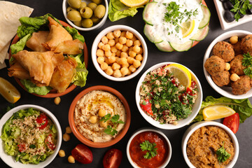 assorted of lebanese food (hummus, tabbouleh, sauce, falafel)