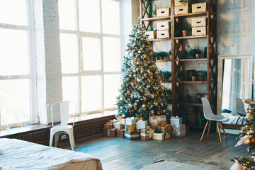 warm cozy beautiful modern design of the room in delicate light colors decorated with Christmas tree and decorative elements fireplace