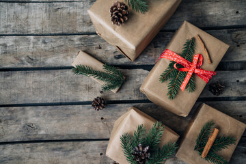Many Christmas presents on dark wooden background in vintage style
