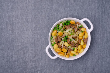 Baked gnocchi with stews and vegetables.