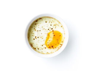 Baked egg isolated on white, from above