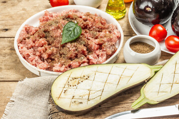 Stuffed eggplant ready to bake with ground meat, vegetables, and spices