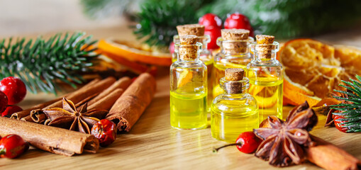 Christmas essential oils in a small bottle. Selective focus.
