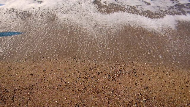 Inscription on the sand on the beach. Selective focus.