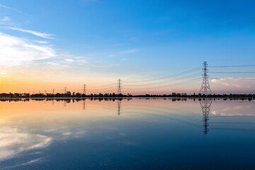 Electric poles with evening light in the countryside