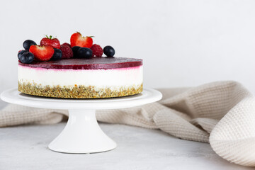 Vegan cauliflower cake on a stand. Sugar, gluten and lactose free.