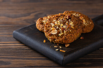 Quinoa cookies on a dark wooden board. Sugar, gluten and lactose free and vegan.