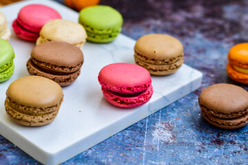 Selection of colorful french macaroons on   industrial background . Patisserie Banner