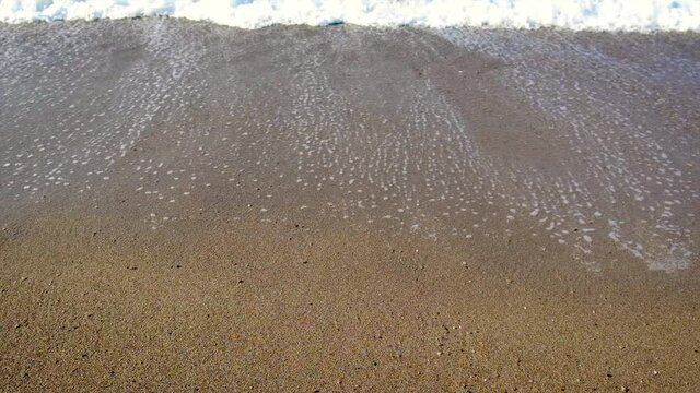 Inscription on the sand on the beach. Selective focus.