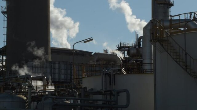Smoke and contamination going out pipes of a industrial factory