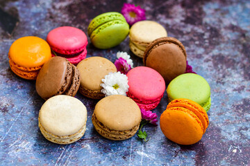  Colorful french macaroons on wooden background