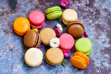  Colorful french macaroons on wooden background