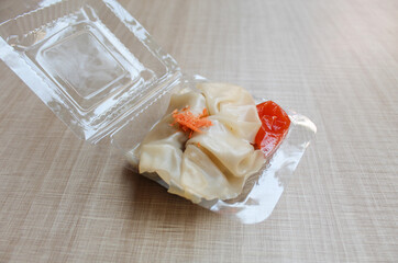 Affordable version of dumplings, with a small packet of sauce