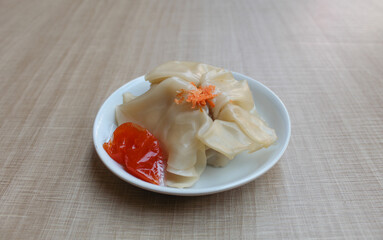 Affordable version of dumplings, with a small packet of sauce