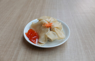 Affordable version of dumplings, with a small packet of sauce