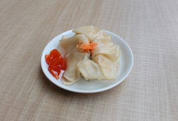 Affordable version of dumplings, with a small packet of sauce