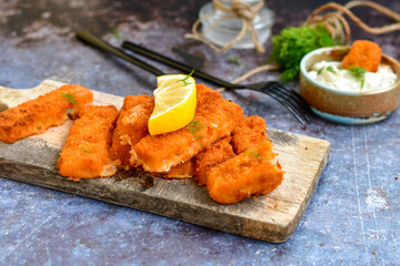  Fish and chips.Close up of crispy breaded  deep fried alaska pollock  fillets  with breadcrumbs...