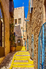 atmosphere of antiquity in one of streets of old Jaffa. The streets are narrow, the stones are worn to shine. impression is that you are transported to Middle Ages