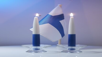 The traditional blue and white candles and flag of Finland - Powered by Adobe