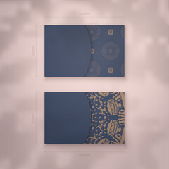 Blue color business card template with greek brown pattern for your personality.
