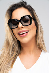 sunglasses, woman, fashion, glasses, beauty, face, model, hair, people, lady, person, glamour, summer, lips, teen, one, smile, brunette, studio, style, eyes, stylish, black, elegance, looking