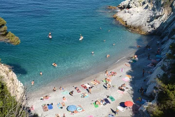 Foto op Plexiglas Cala degli Inglesi also called Transilvania beach is one of the most beautiful coves in Liguria also for the blue color of the sea. © aliberti