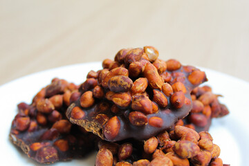 Gula kacang, is a traditional snack from Indonesia, made from roasted peanuts and brown sugar. Also...